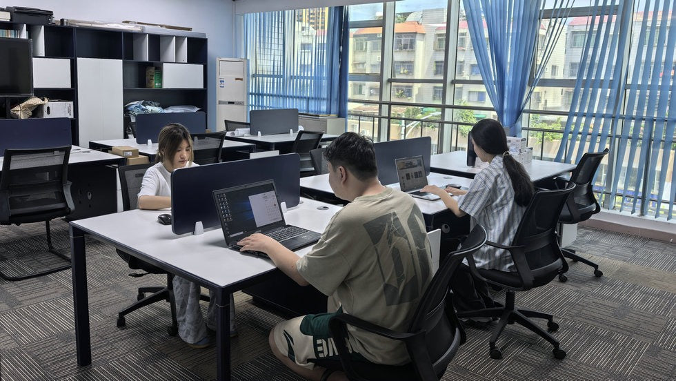 Herman team working at desktop workstations